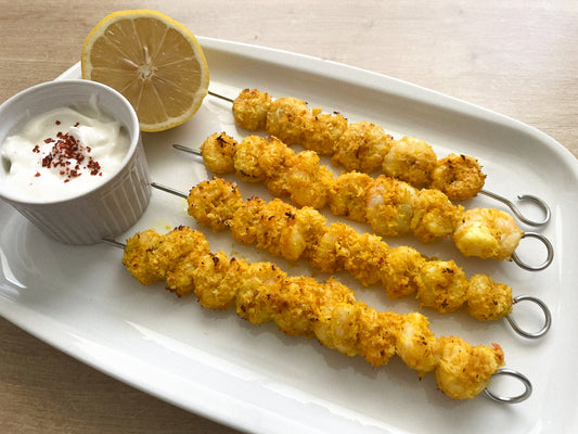 Brochetas de langostinos al curry